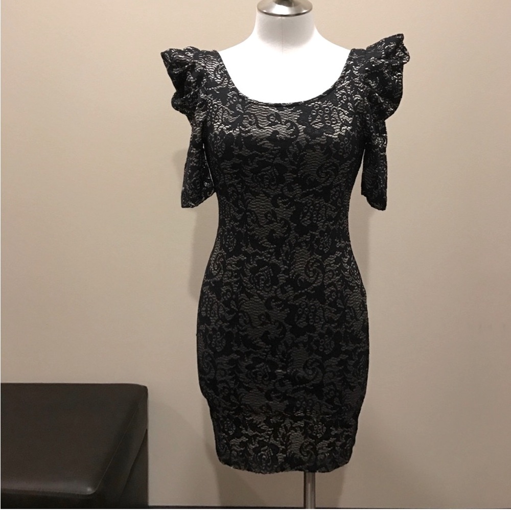 Backless fitted black and gold dress